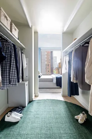 a bedroom with furniture and a window