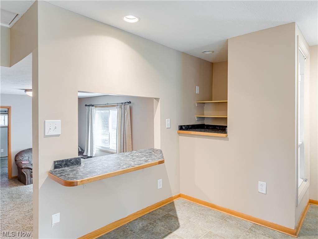 8260 Ravenna Road Hudson, OH 44236 - Photo 8 of 21 Kitchen with light tile flooring