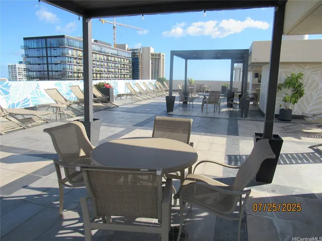 a view of a dining room with furniture wooden floor and a chandelier