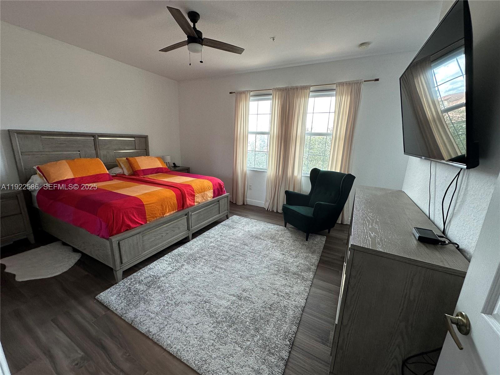 2662 Southwest 118 Road, Unit 2662 Miramar, FL 33025 - Photo 14 of 28 a bed room with a bed window and a television