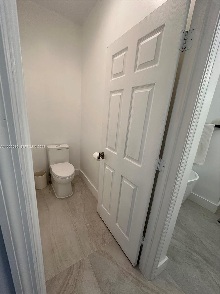 2662 Southwest 118 Road, Unit 2662 Miramar, FL 33025 - Photo 19 of 28 a bathroom with a sink and a toilet