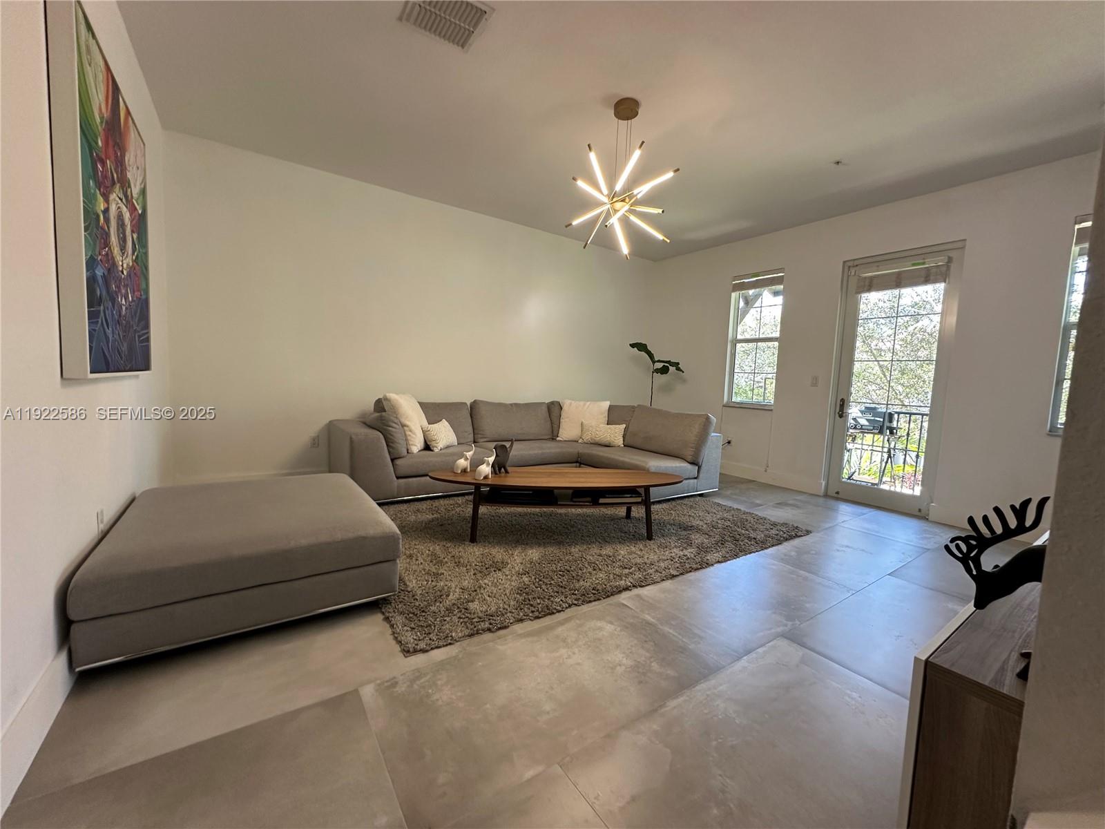 2662 Southwest 118 Road, Unit 2662 Miramar, FL 33025 - Photo 4 of 28 a living room with furniture and a window