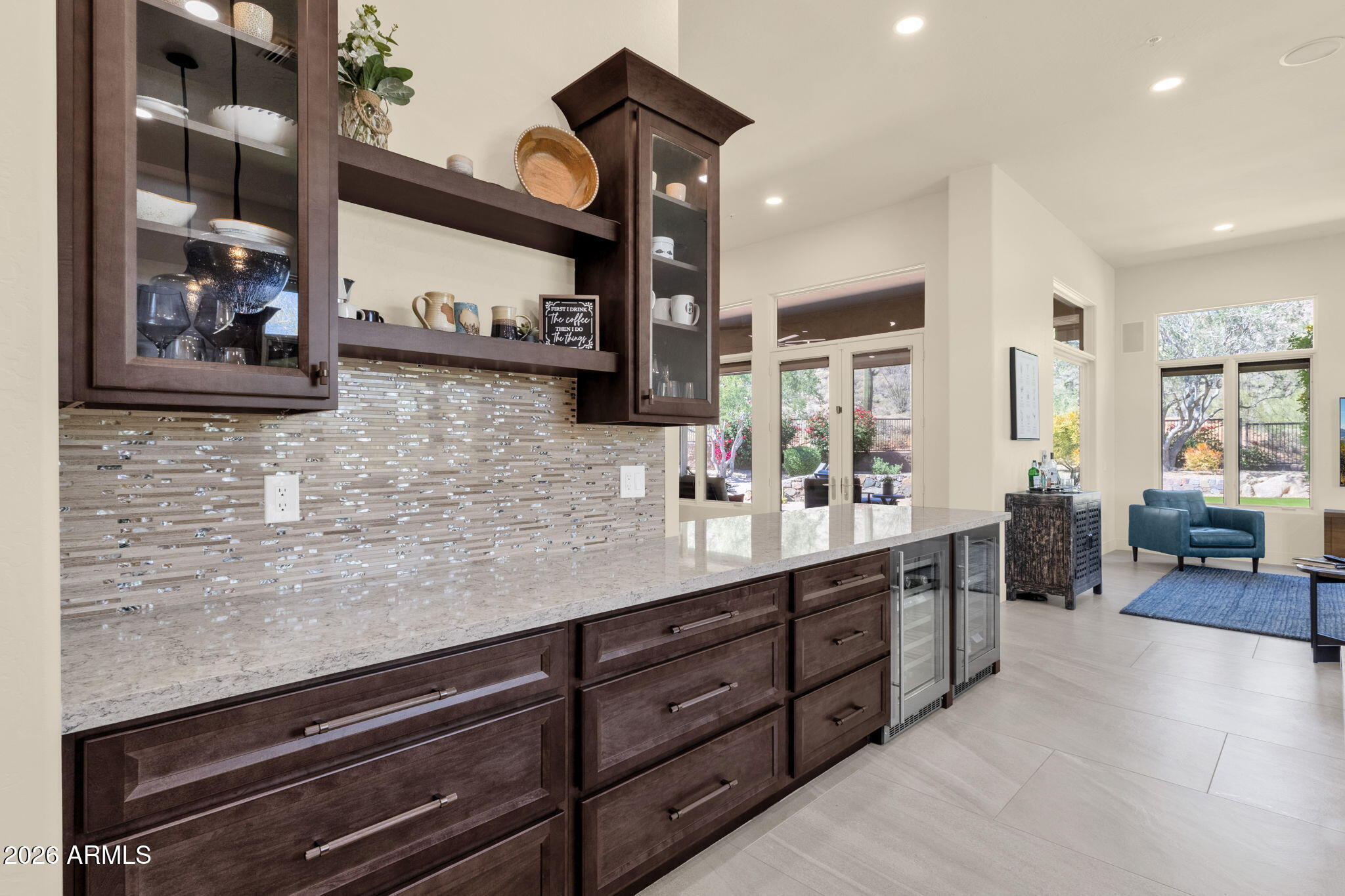 14402 East Wethersfield Road Scottsdale, AZ 85259 - Photo 15 of 57 a kitchen with stainless steel appliances granite countertop a sink and cabinets