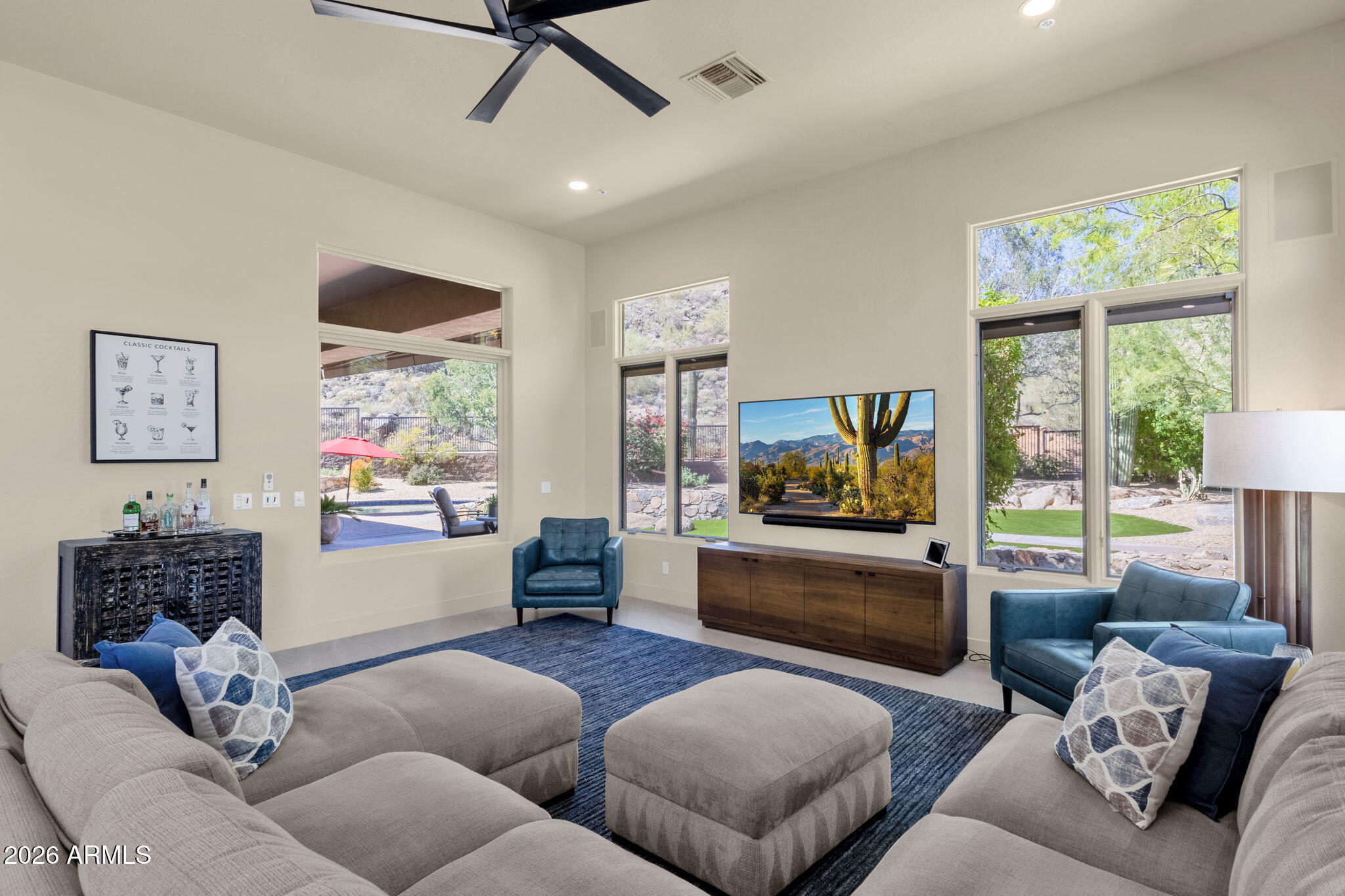 14402 East Wethersfield Road Scottsdale, AZ 85259 - Photo 17 of 57 a living room with furniture and a flat screen tv