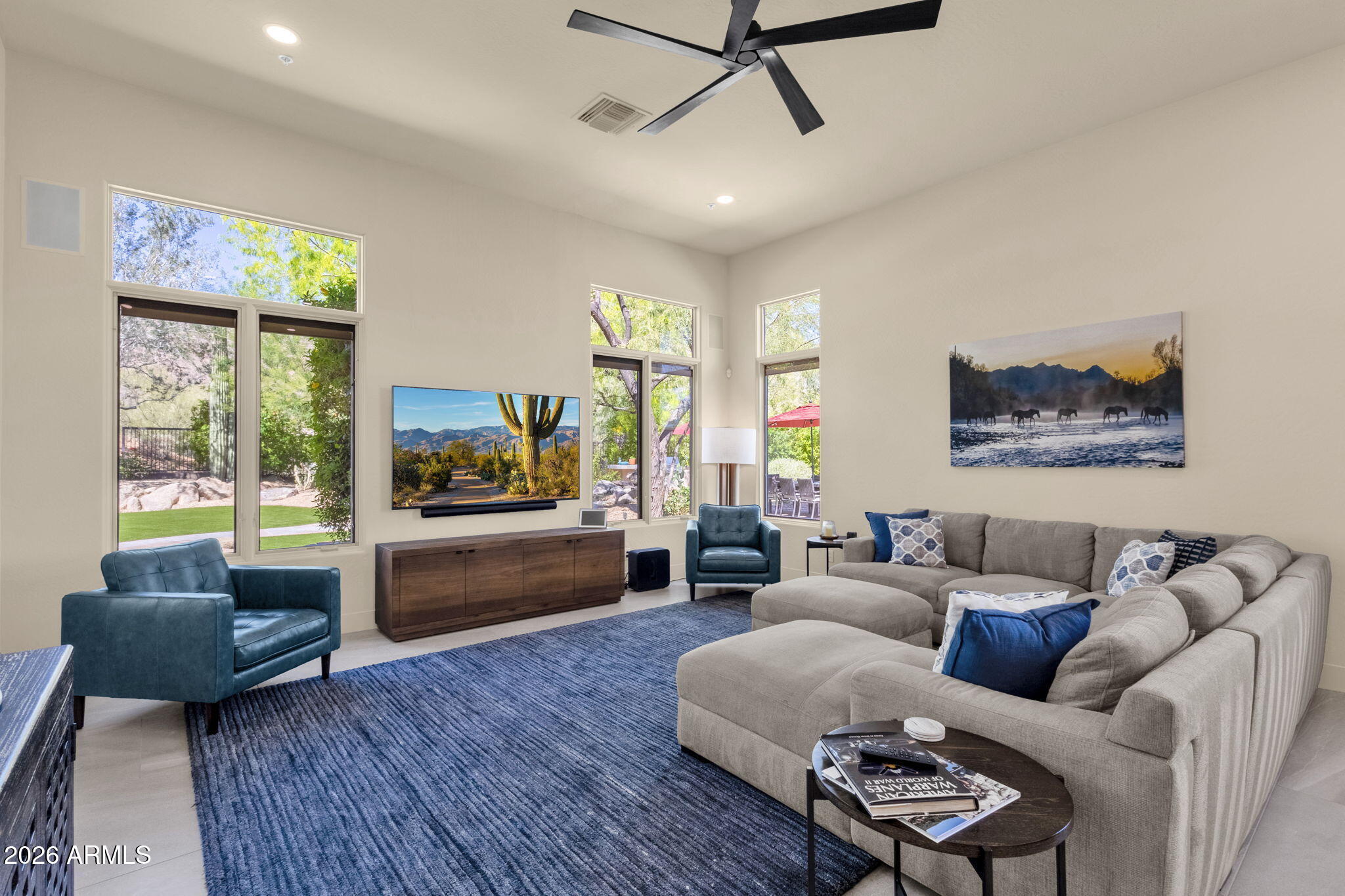 14402 East Wethersfield Road Scottsdale, AZ 85259 - Photo 18 of 57 a living room with furniture and a flat screen tv