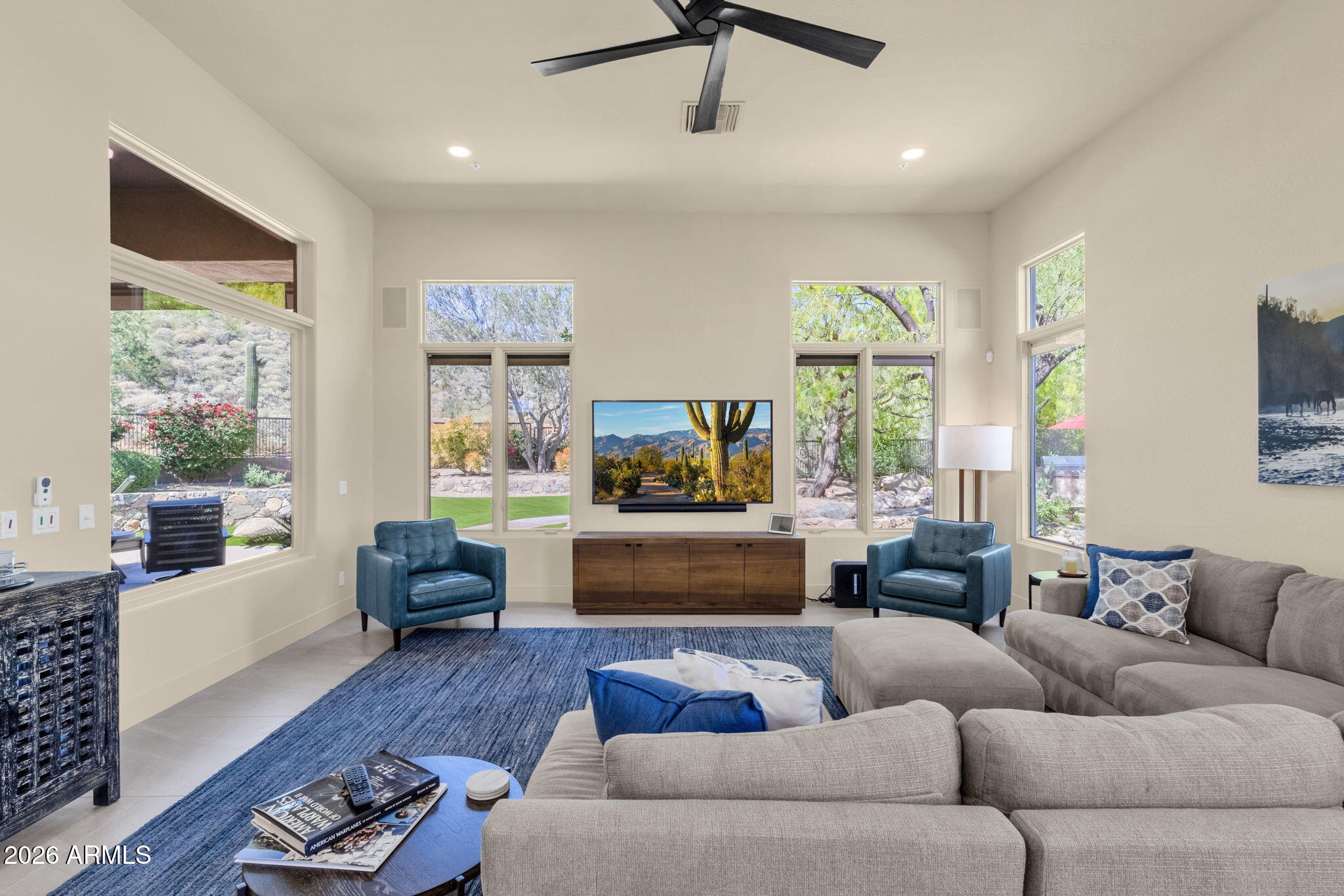 14402 East Wethersfield Road Scottsdale, AZ 85259 - Photo 19 of 57 a living room with furniture and a large window
