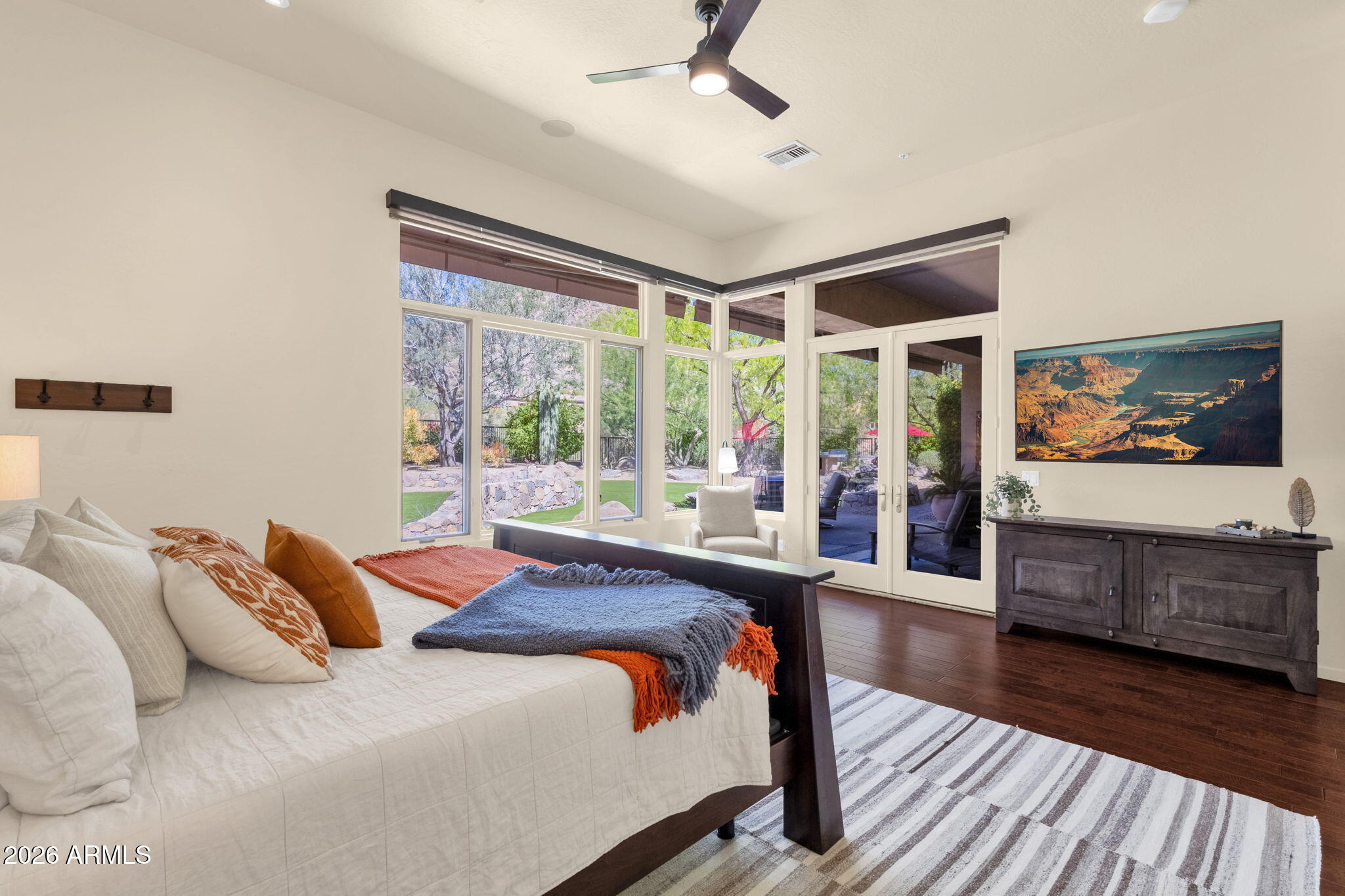 14402 East Wethersfield Road Scottsdale, AZ 85259 - Photo 21 of 57 a bedroom with a large bed and a large window