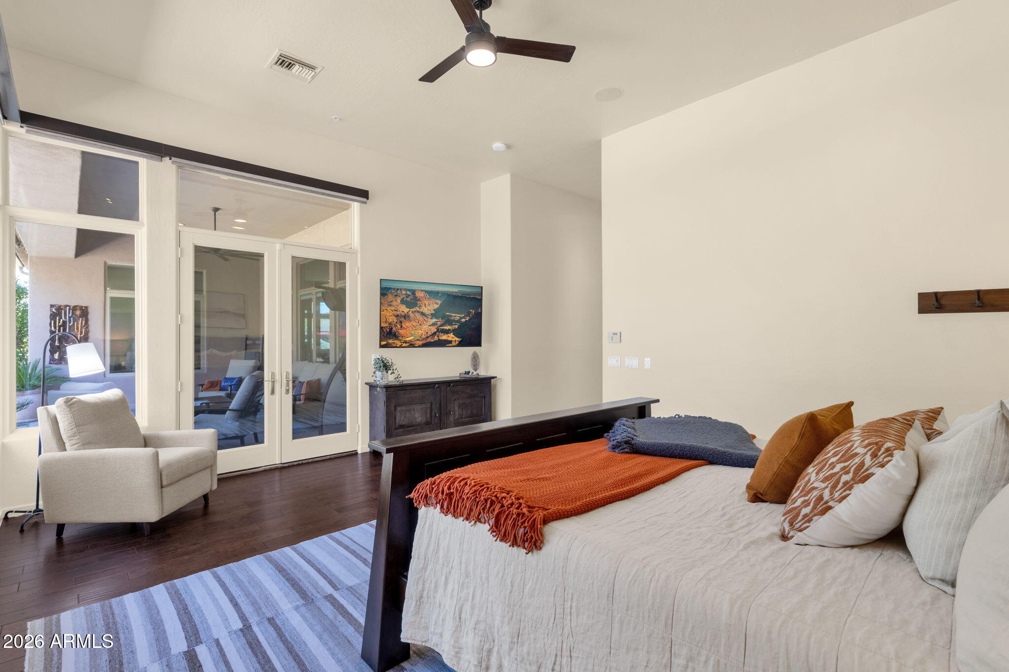 14402 East Wethersfield Road Scottsdale, AZ 85259 - Photo 22 of 57 a bedroom with a large bed and a couch