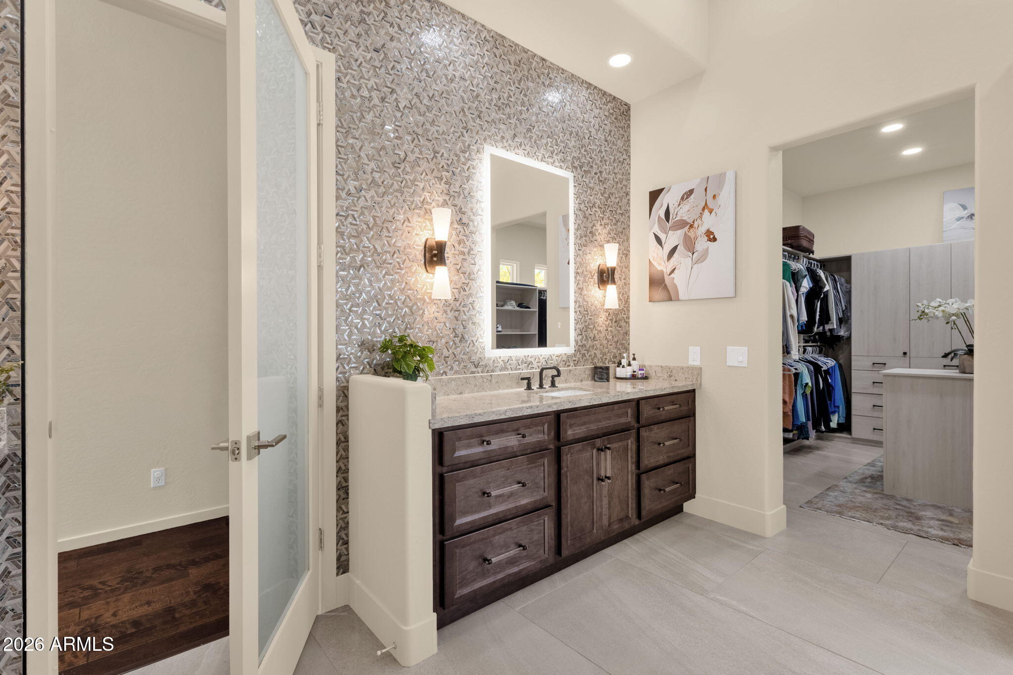 14402 East Wethersfield Road Scottsdale, AZ 85259 - Photo 25 of 57 a spacious bathroom with a double vanity sink shower and a mirror