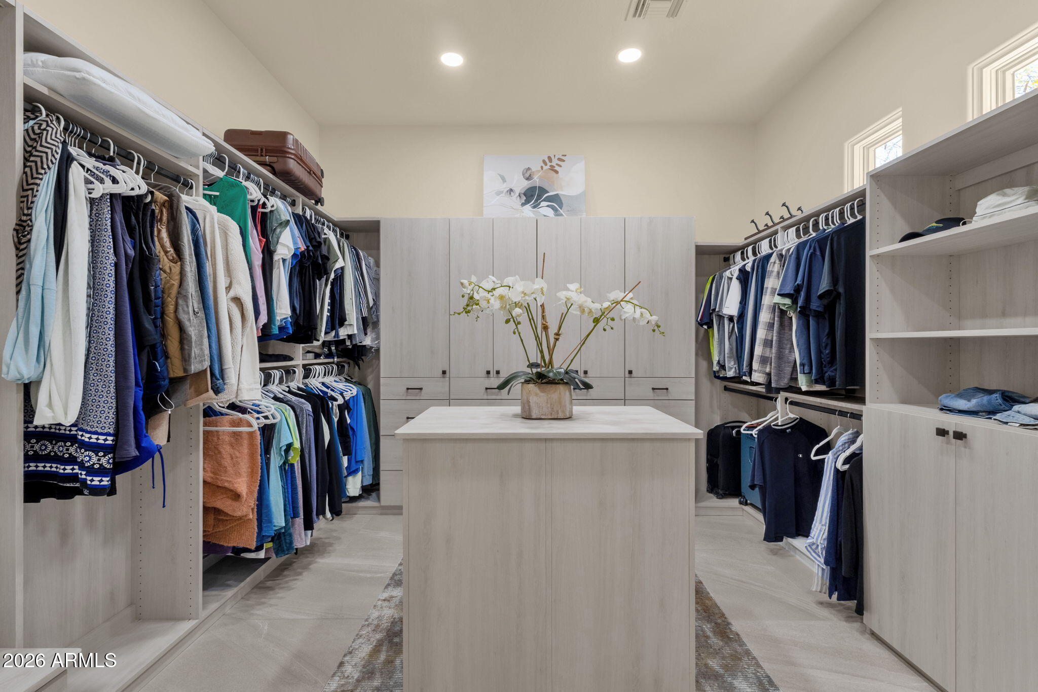 14402 East Wethersfield Road Scottsdale, AZ 85259 - Photo 26 of 57 a view of walk in closet with clothes and shoes