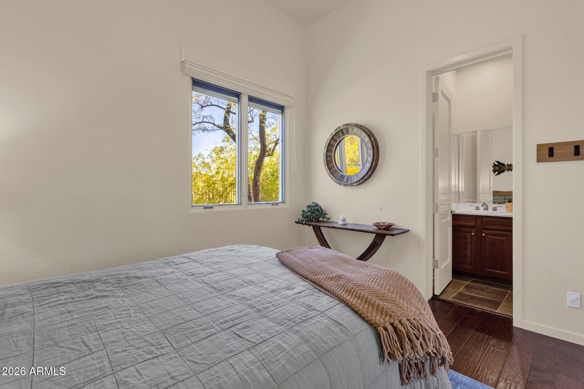 14402 East Wethersfield Road Scottsdale, AZ 85259 - Photo 28 of 57 a bedroom with a bed and a window