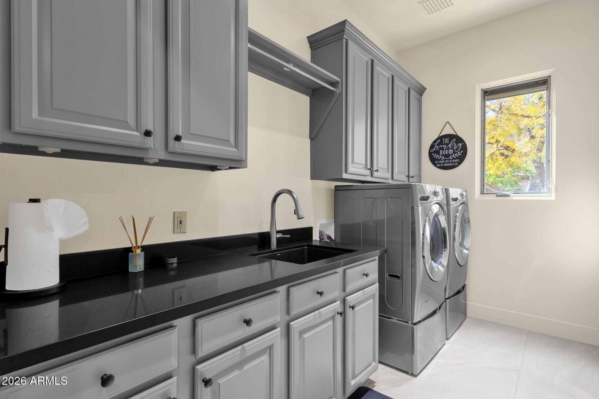 14402 East Wethersfield Road Scottsdale, AZ 85259 - Photo 30 of 57 a kitchen with stainless steel appliances granite countertop white cabinets and a sink