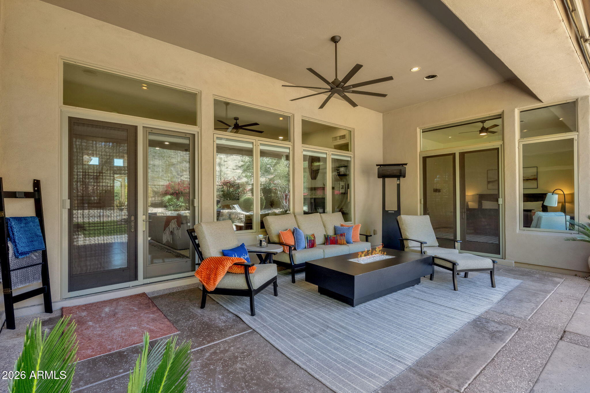 14402 East Wethersfield Road Scottsdale, AZ 85259 - Photo 35 of 57 a patio with patio couch and table