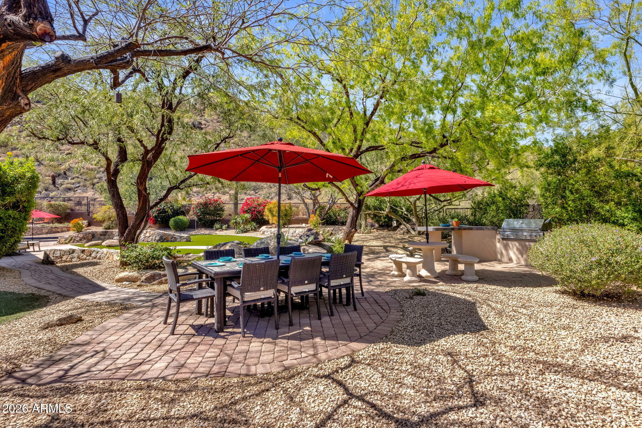 14402 East Wethersfield Road Scottsdale, AZ 85259 - Photo 41 of 57 an outdoor space with patio and umbrella
