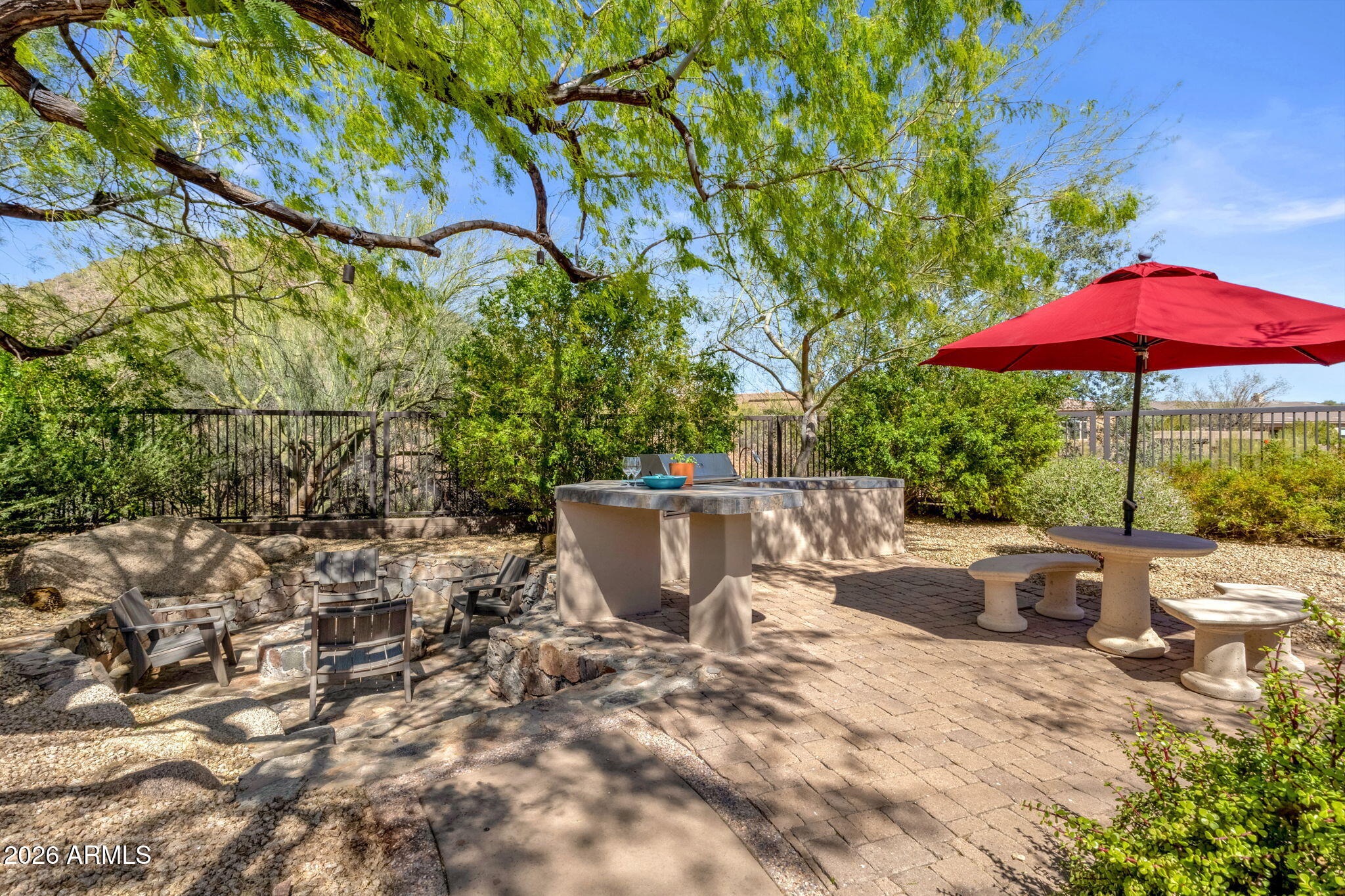 14402 East Wethersfield Road Scottsdale, AZ 85259 - Photo 42 of 57 a view of a backyard with sitting area and furniture