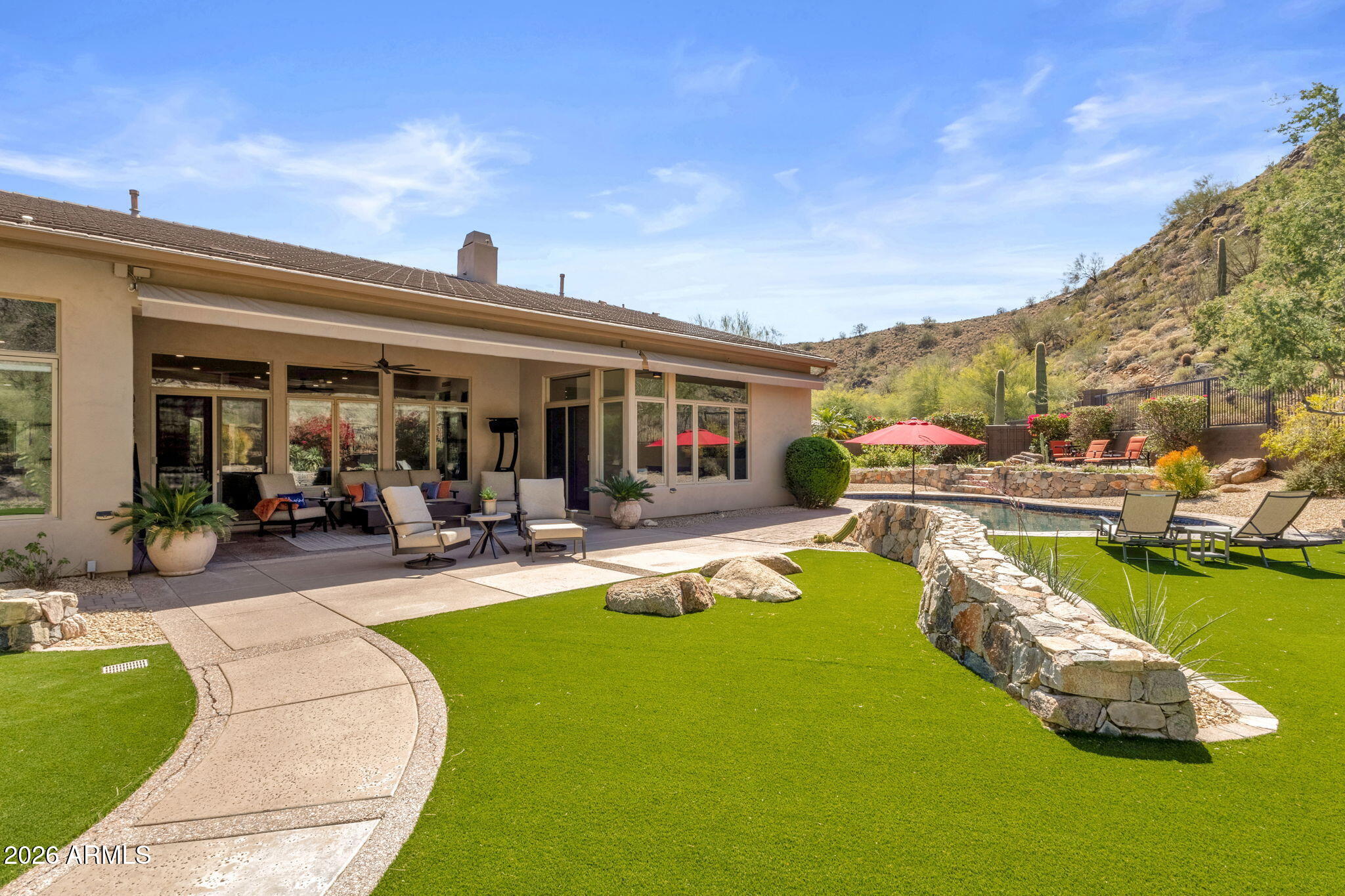 14402 East Wethersfield Road Scottsdale, AZ 85259 - Photo 44 of 57 a view of a house with swimming pool and porch