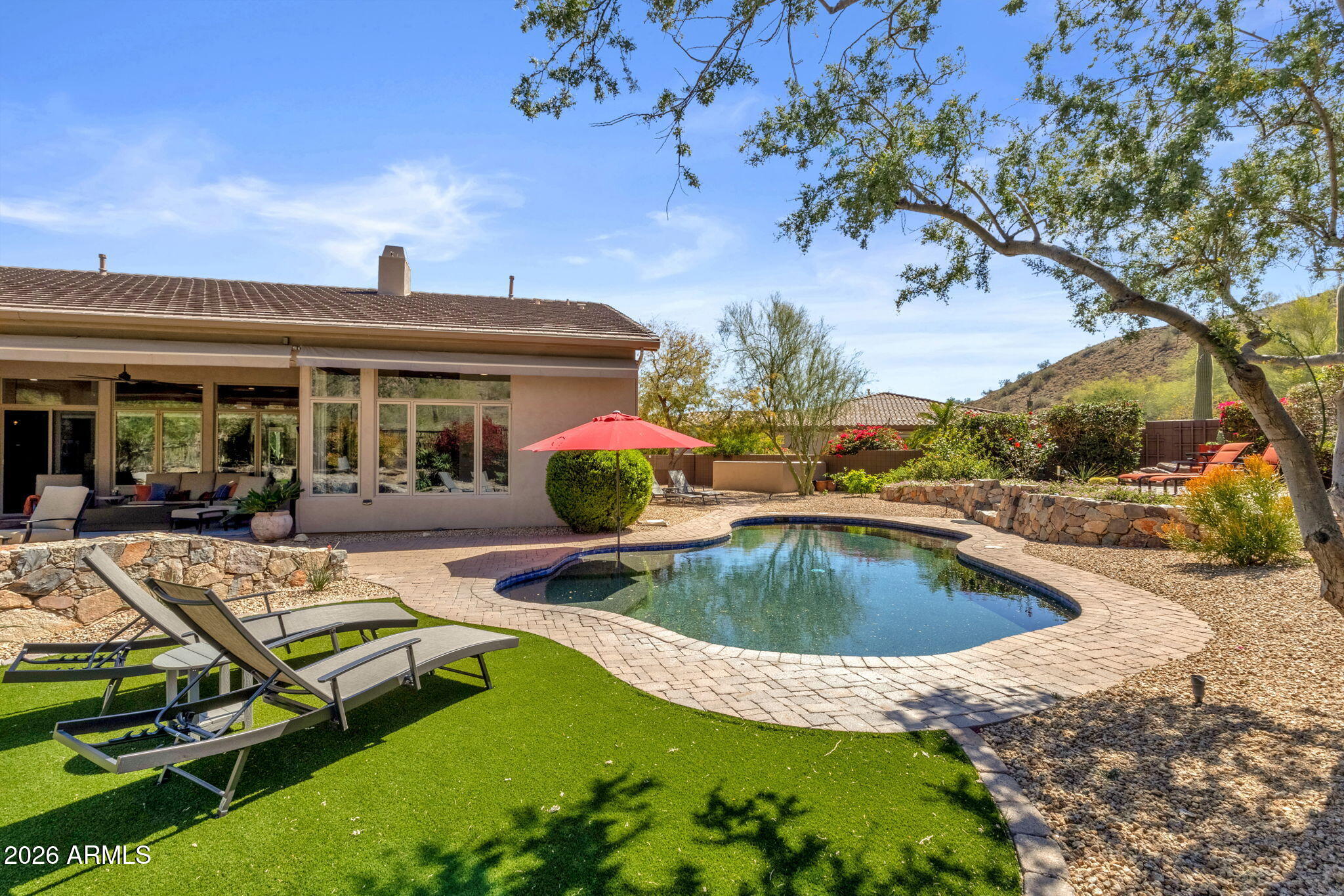 14402 East Wethersfield Road Scottsdale, AZ 85259 - Photo 45 of 57 a view of a house with swimming pool and porch