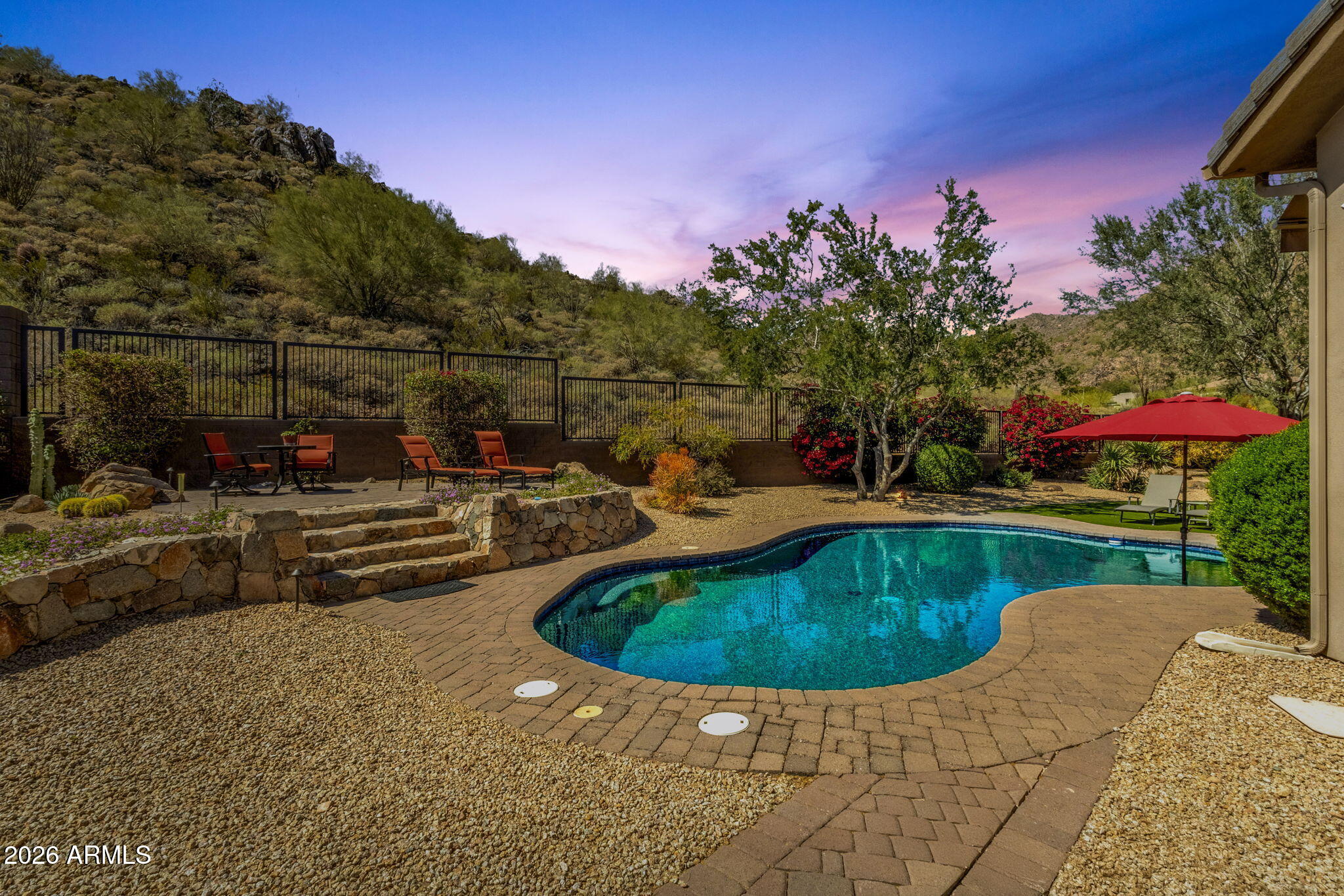 14402 East Wethersfield Road Scottsdale, AZ 85259 - Photo 51 of 57 a view of a swimming pool with a yard