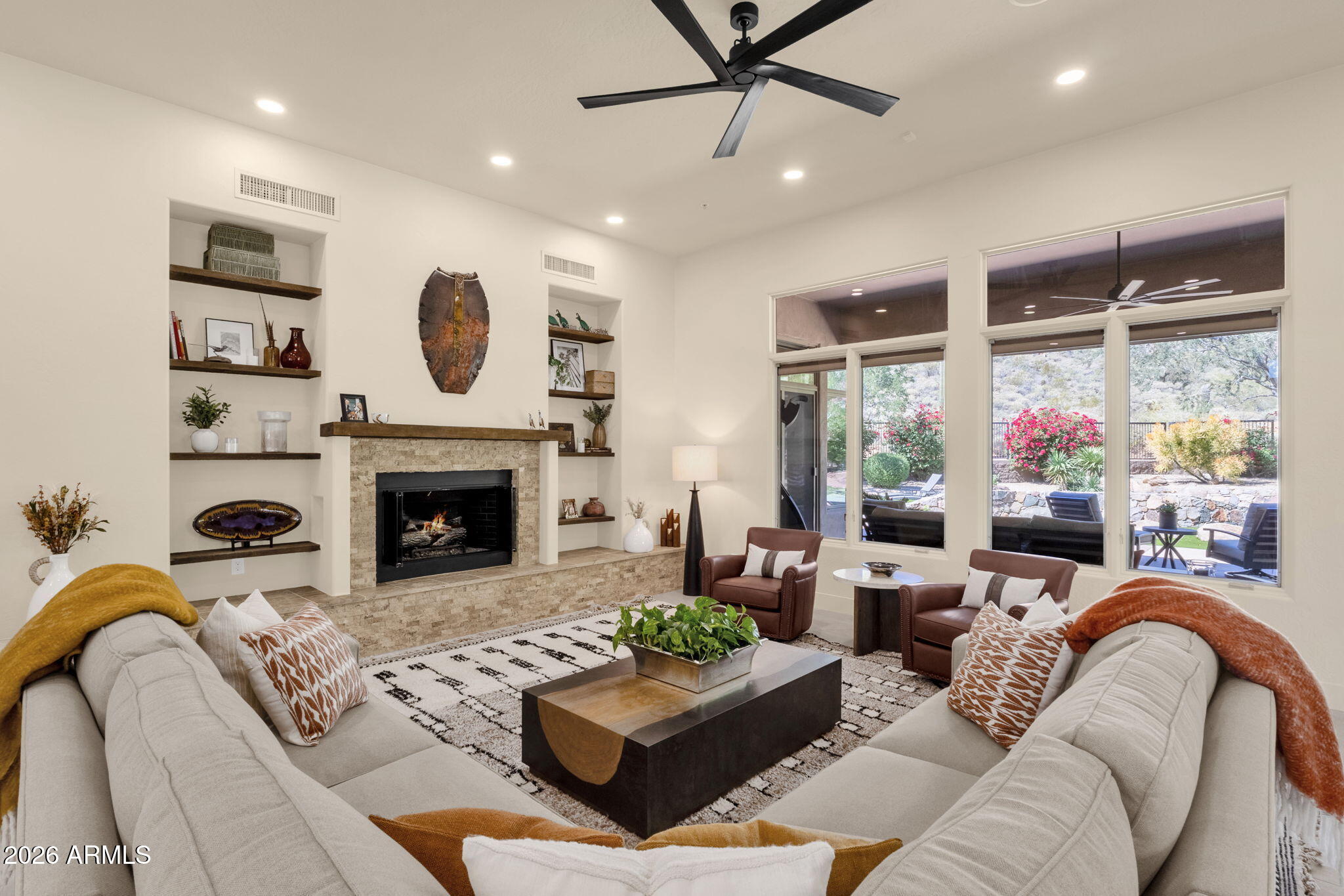 14402 East Wethersfield Road Scottsdale, AZ 85259 - Photo 6 of 57 a living room with furniture and a fireplace