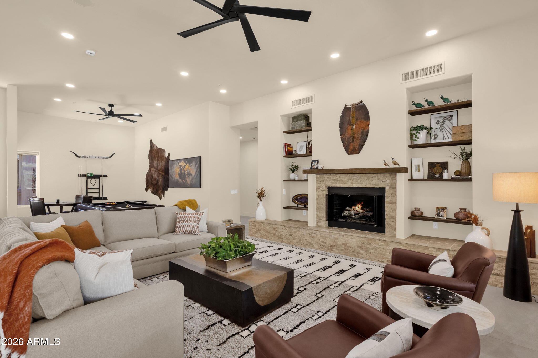 14402 East Wethersfield Road Scottsdale, AZ 85259 - Photo 8 of 57 a living room with furniture and a fireplace
