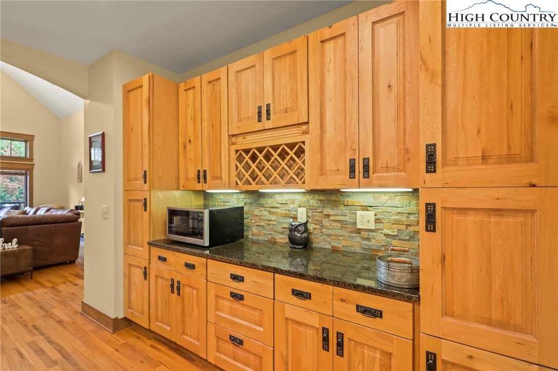 138 South Camp Road, Unit 103 Boone, NC 28607 - Photo 14 of 50 a view of a kitchen with wooden floor and windows