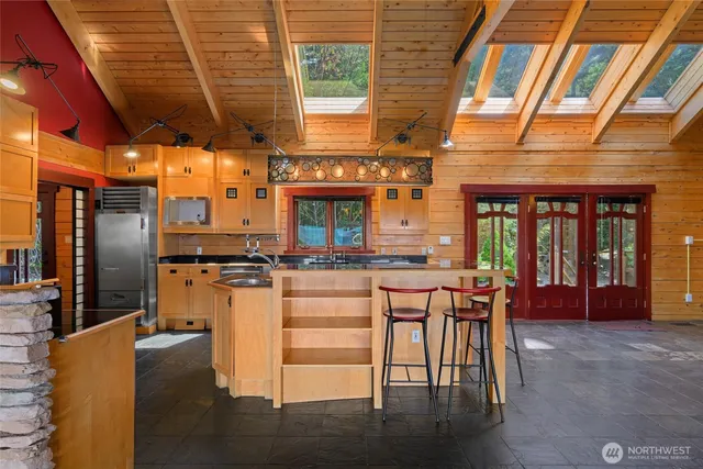 a kitchen that has a sink and a stove