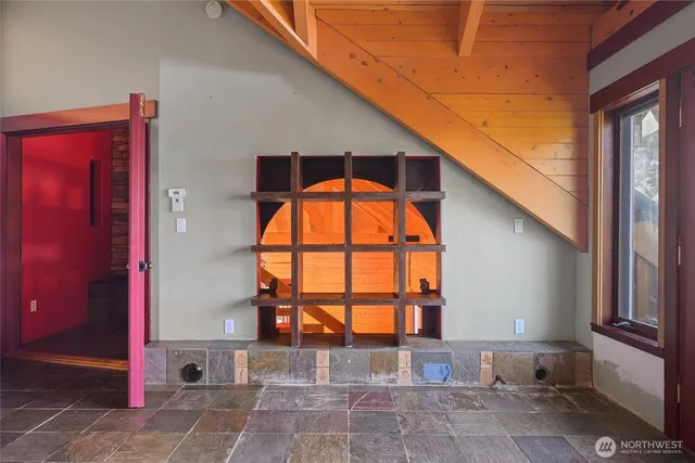 a spacious bathroom with a granite countertop sink and a mirror