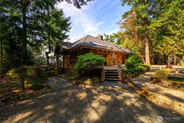 a view of a fire pit with large trees