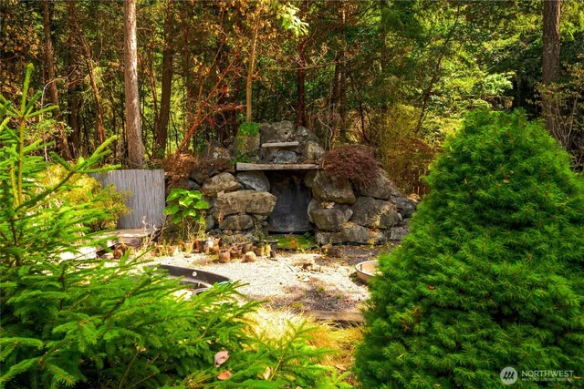 a view of a house with a tree