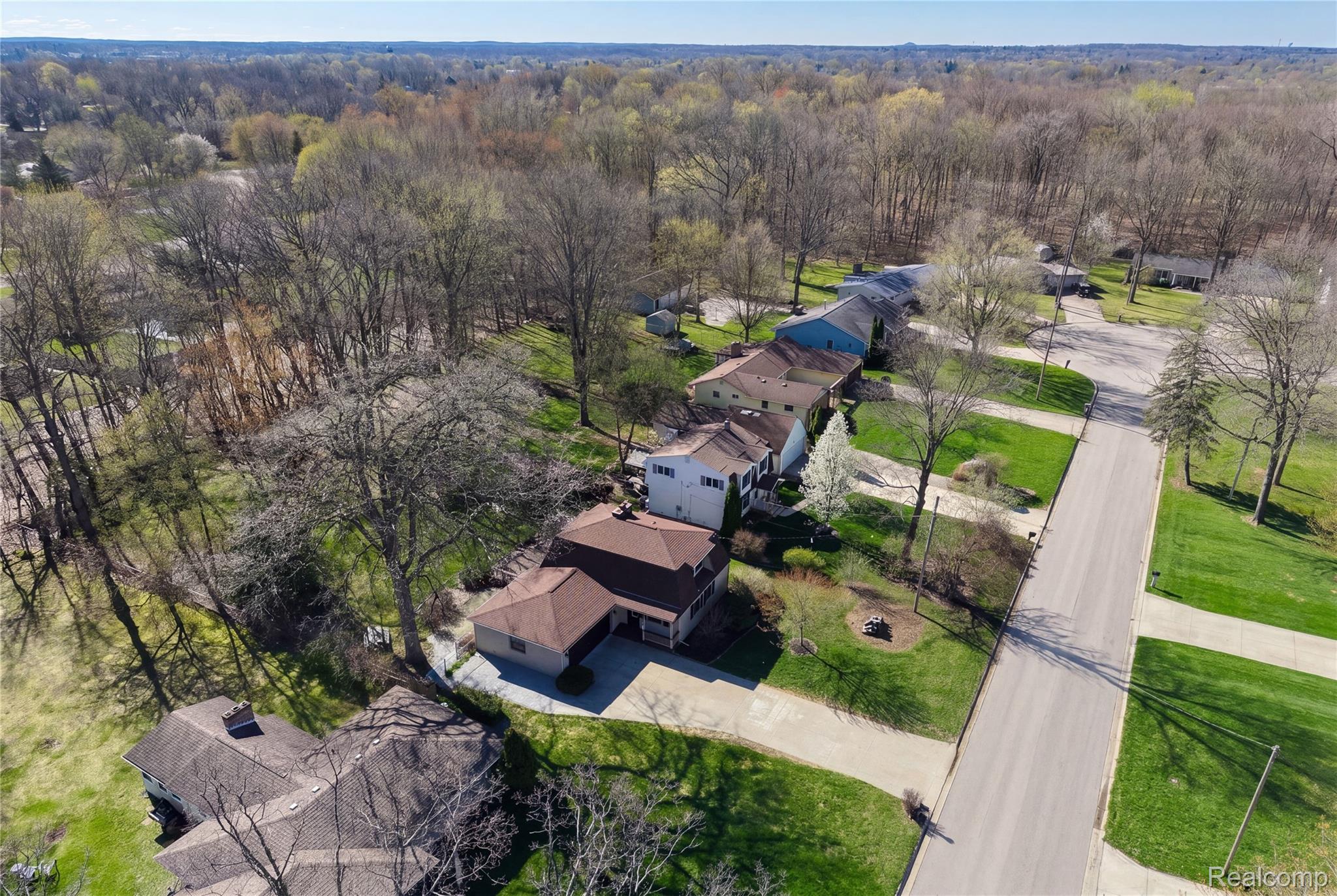 6273 Cold Spring Trail Grand Blanc, MI 48439 - Photo 11 of 48 Aerial view of residential area featuring a heavily wooded area