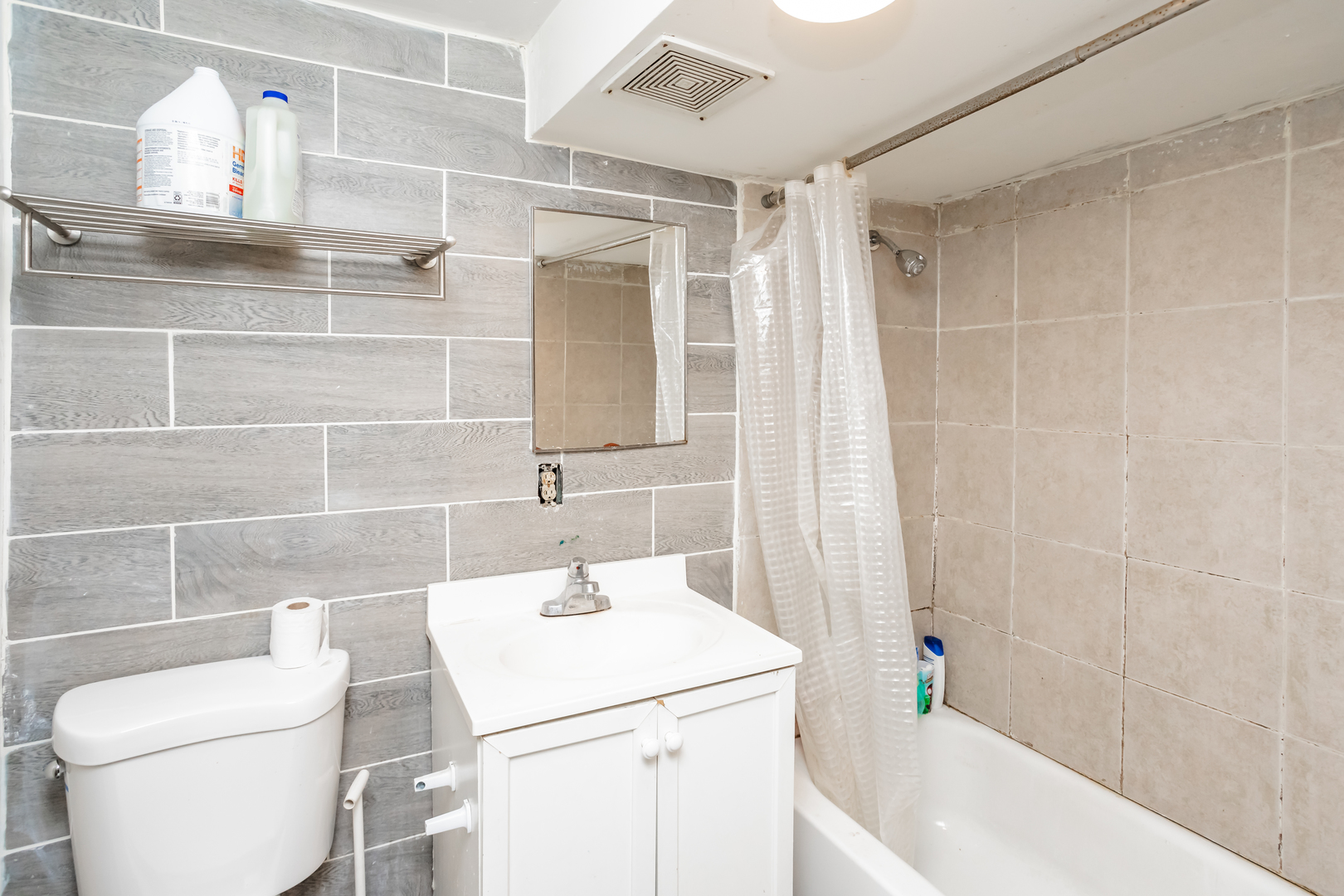 3108 West 54th Place Chicago, IL 60632 - Photo 6 of 7 a bathroom with a sink a toilet and shower