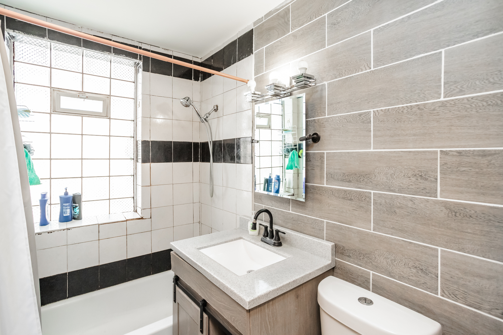 3108 West 54th Place Chicago, IL 60632 - Photo 7 of 7 a bathroom with a sink toilet vanity and shower