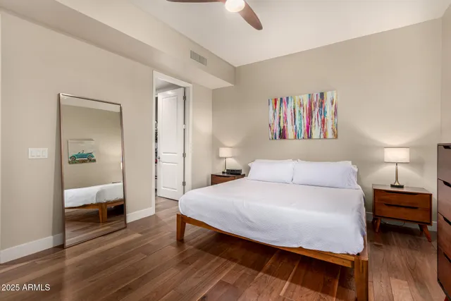 a bedroom with a bed and a view of bathroom