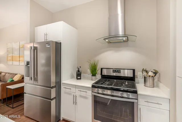 a kitchen with a stove and a refrigerator