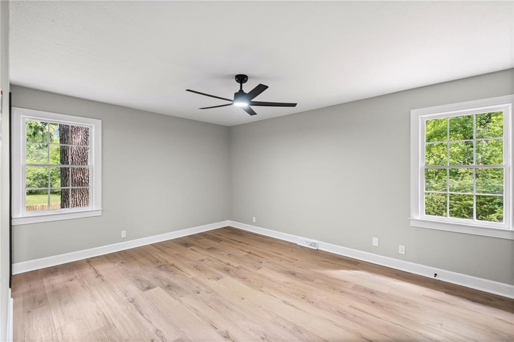 7 East Creekview Drive Southwest Rome, GA 30165 - Photo 17 of 43 a view of a room with a ceiling fan and window