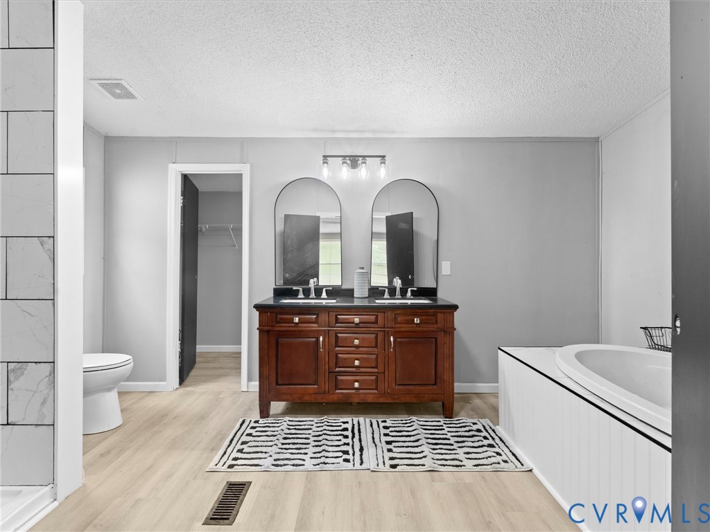 1909 Neves Road Beaverdam, VA 23015 - Photo 26 of 48 Dual sink vanity with dark wood-finish cabinetry,