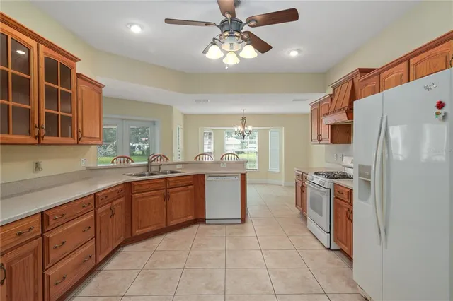 a view of kitchen with furniture and chandelier