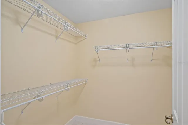 a bathroom with a sink a large mirror and a shower