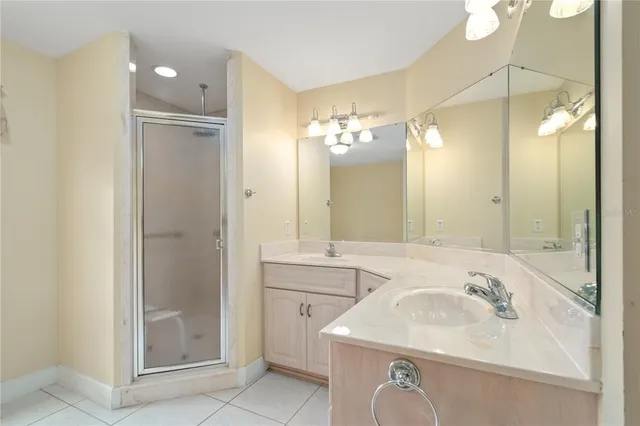 a bathroom with a tub and shower