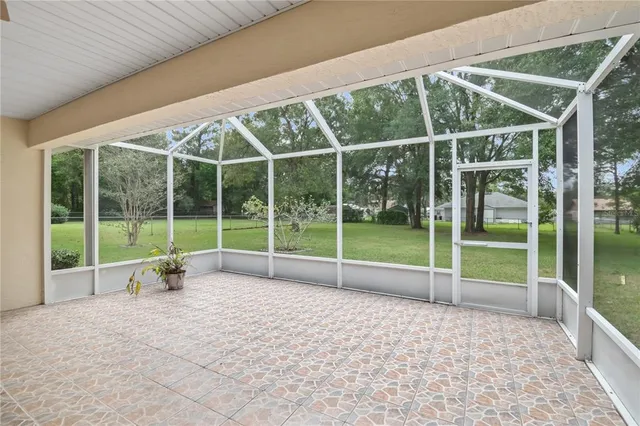 a view of an empty room with glass door