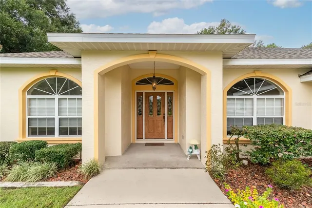 a front view of a house with a glass door