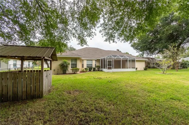 a view of outdoor space with deck and yard