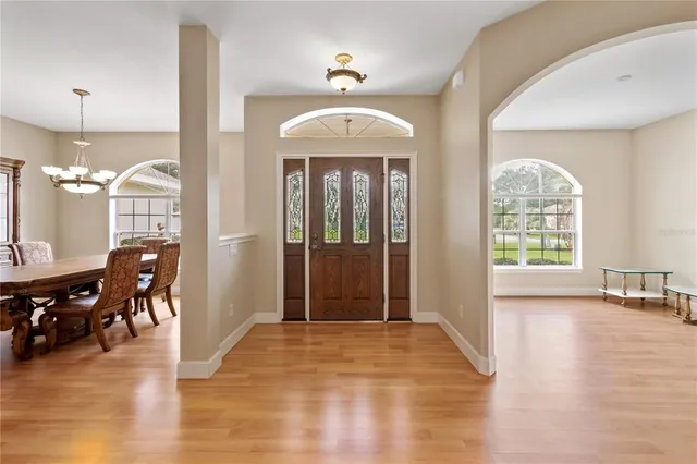 a view of a livingroom with furniture window and wooden floor
