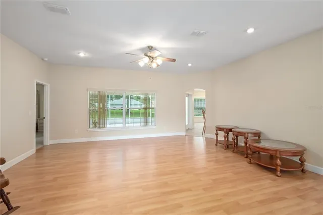 a view of a livingroom with furniture and a chandelier