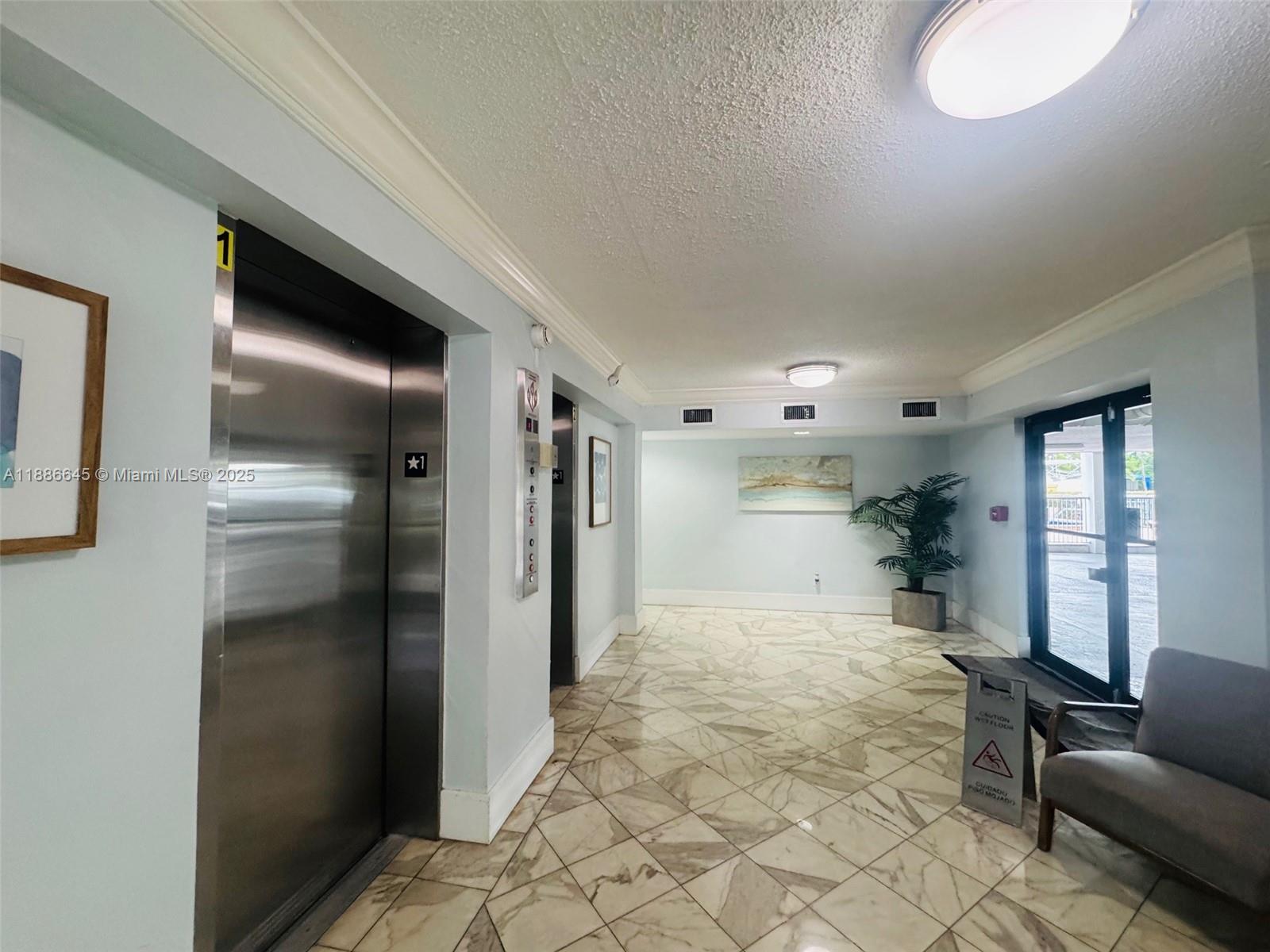 2000 Northeast 135th Street, Unit 403 North Miami, FL 33181 - Photo 16 of 23 Lobby/Elevator Area