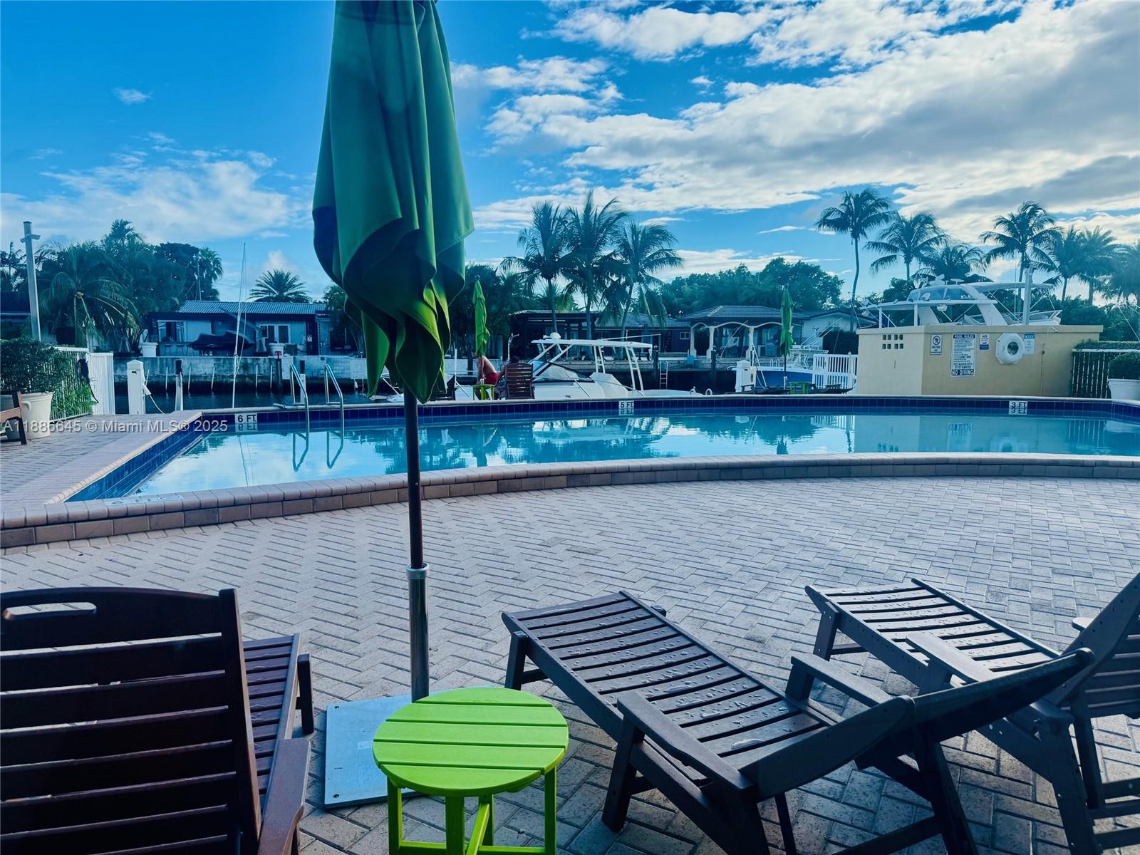 2000 Northeast 135th Street, Unit 403 North Miami, FL 33181 - Photo 20 of 23 Pool Area Beside Canal & Boat Docks