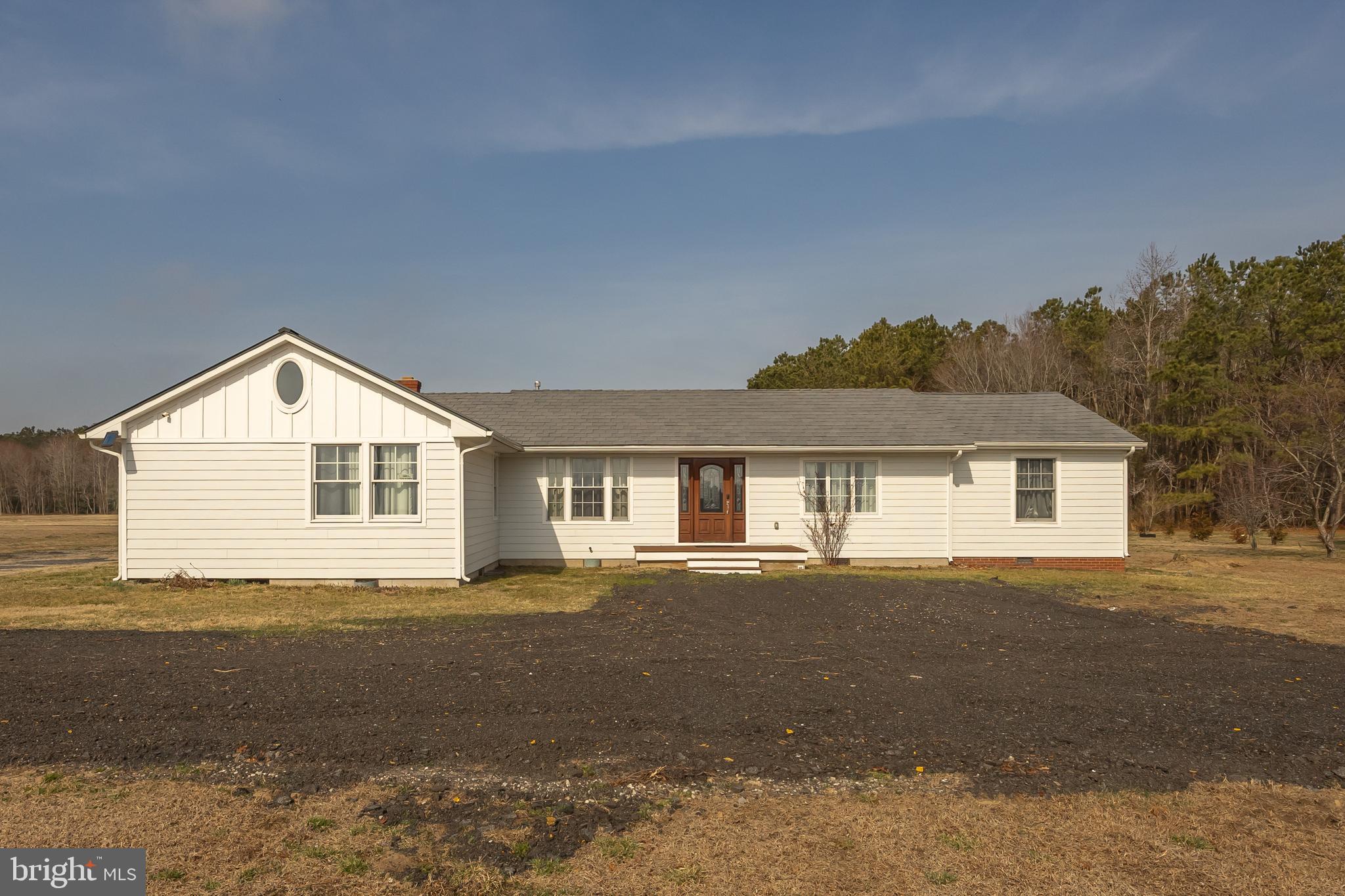 14470 Backbone Road Eden, MD 21822 - Photo 1 of 55 a front view of a house with a yard