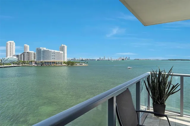 a view of a city from a balcony with outdoor space