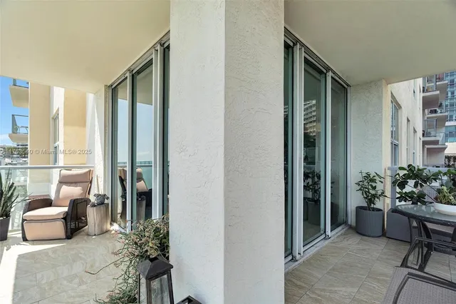 a lobby with furniture and potted plant