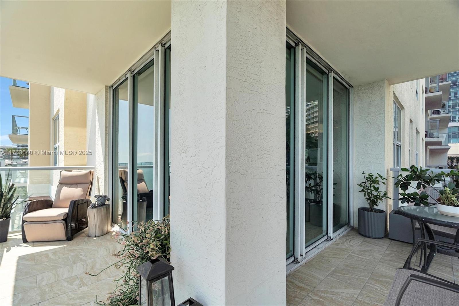 1155 Brickell Bay Drive, Unit 710 Miami, FL 33131 - Photo 9 of 32 a lobby with furniture and potted plant